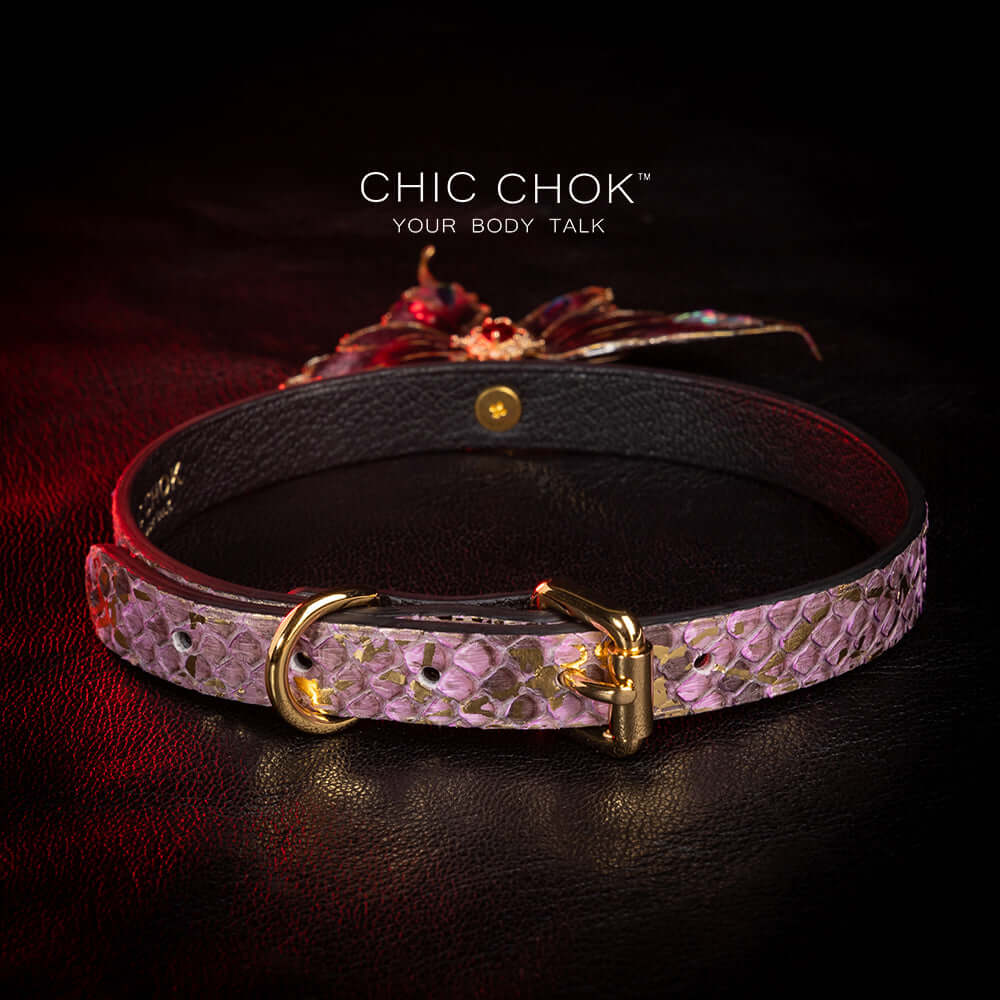 chicchok butterfly choker featuring a textured, intricate butterfly pendant adorned with gold accents and shimmering gemstones for an elegant and luxurious look.