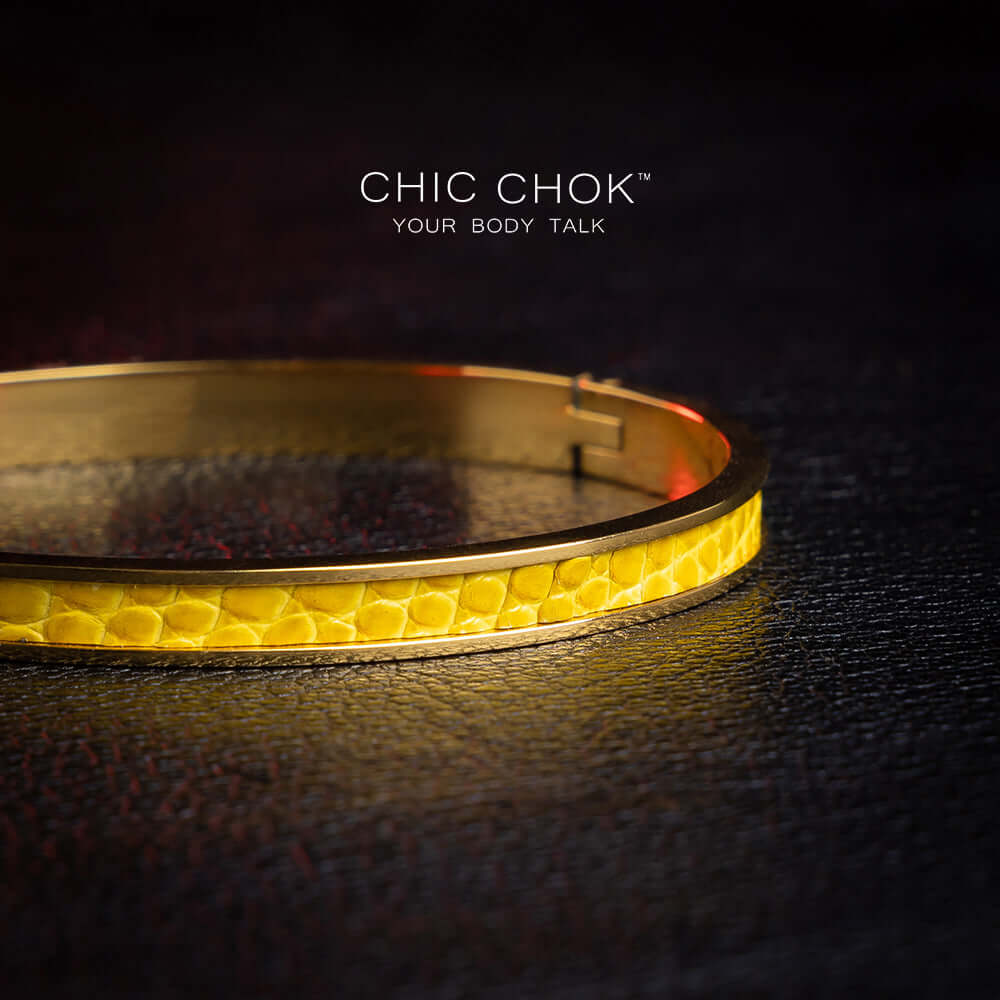 Primitive Mania - Metallic Bracelet A chicchok metal bracelet with yellow lizard skin dances like a nighttime bonfire.
